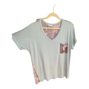 Sky Blue V-Neck Women's Tee with Patterned Accents